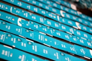 A sea of blue Xerocon badges on a table
